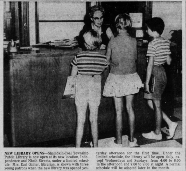 Librarian serving three young patrons at the newly opened Shamokin-Coal Township Public Library in 1962